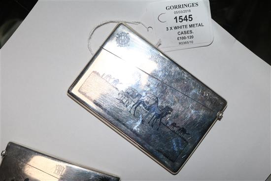 Two continental white metal and niello card cases and a similar cigarette case.